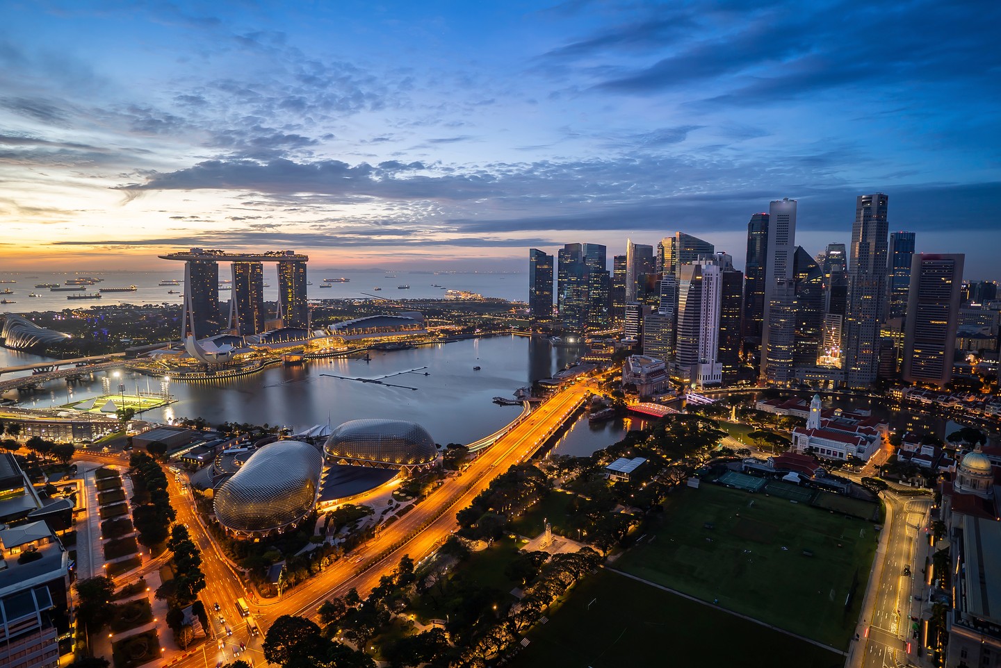 Aerial view of dramatic sunrise at Singapore city skyline